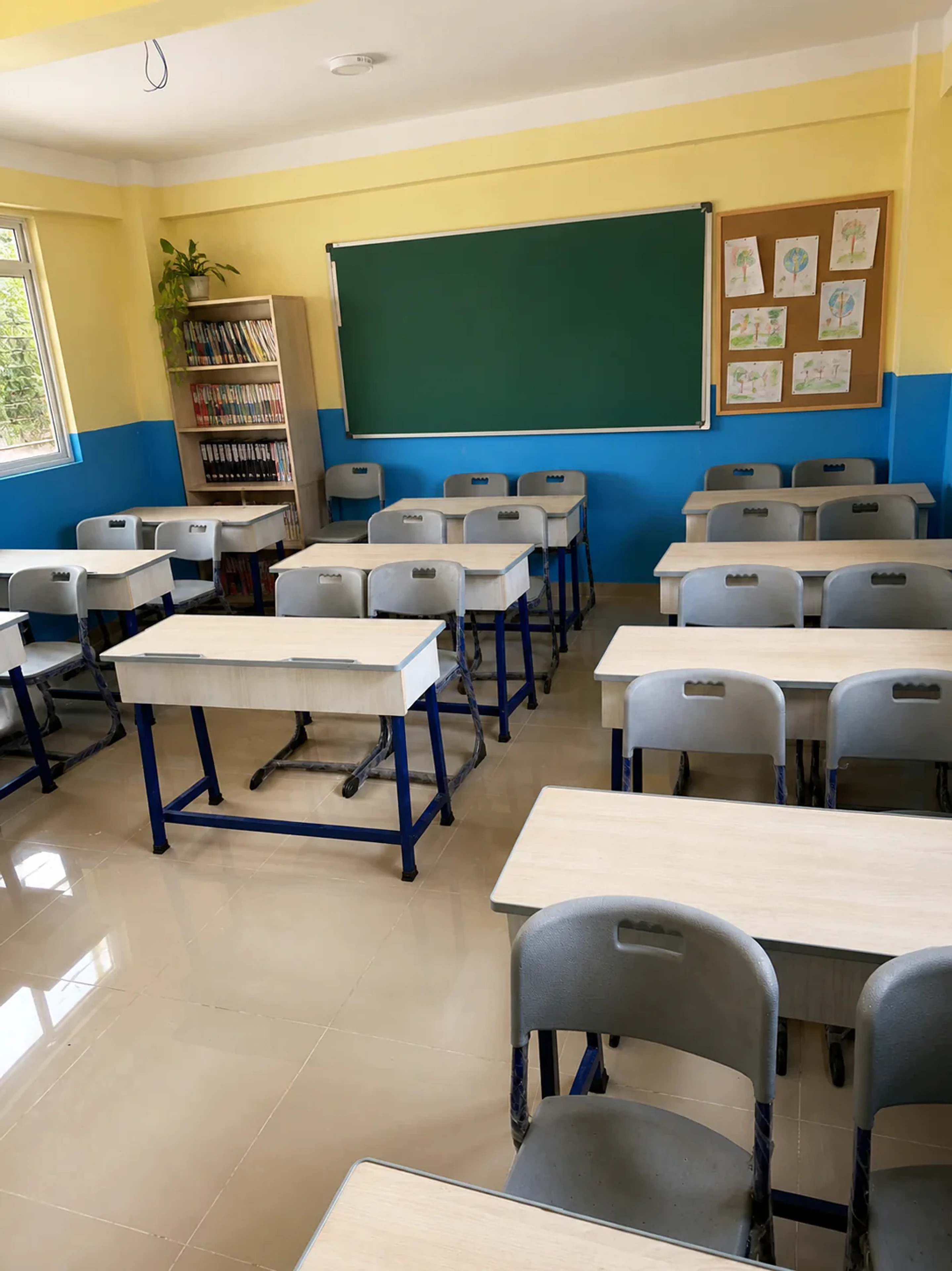 Bright Prakriti Pathshala classroom with desks arranged for learning